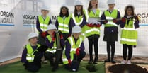 Children bury a time capsule on new 
school site in Abergavenny