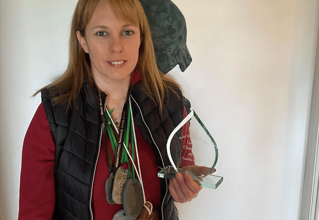 Christina Bowen Bravery with her medals and world championships trophy