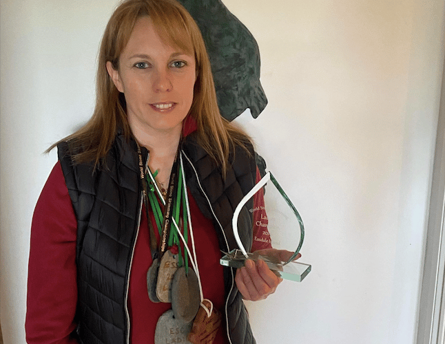 Christina Bowen Bravery with her medals and world championships trophy