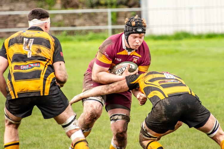 Crunch! An Aber player tries to break through