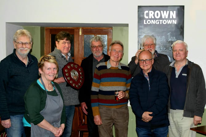 Pictured in the photograph are (from left to right): Steve Hopkins, Sheila Watkins (Crown, Longtown landlady), Mark Jones, Jerry Ross, Peter Overstall, Richard Humphries, Paul Piejus and David Bishop.