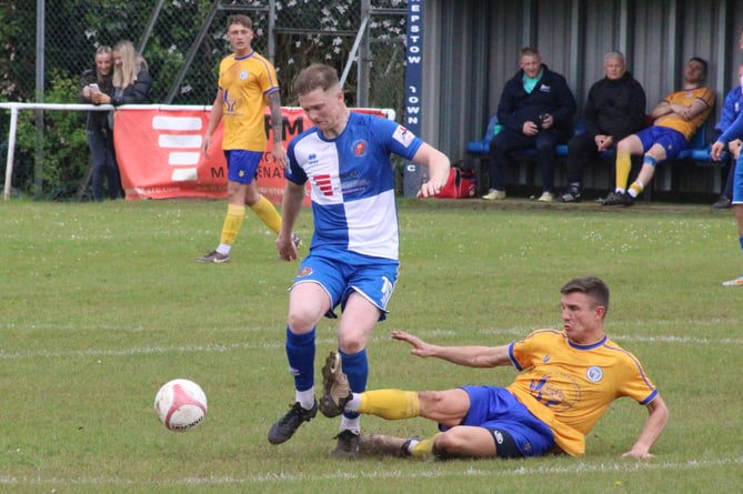 A Blaenavon player gets in a tackle