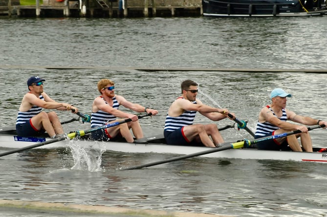 Al Butler, right, and Oliver Patridge, second from right, turn on the power 