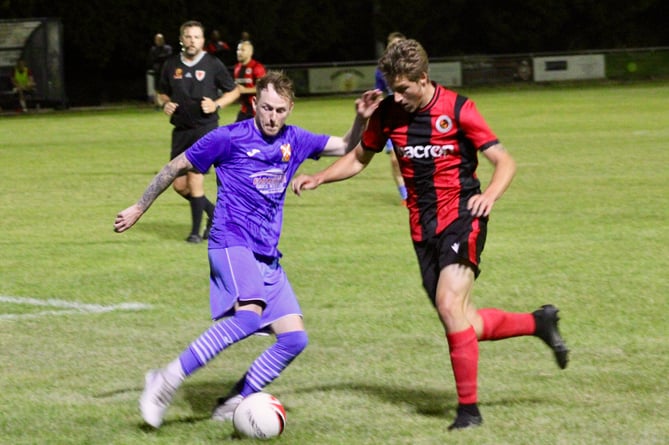 An Abergavenny player tries to get past a Goytre defender