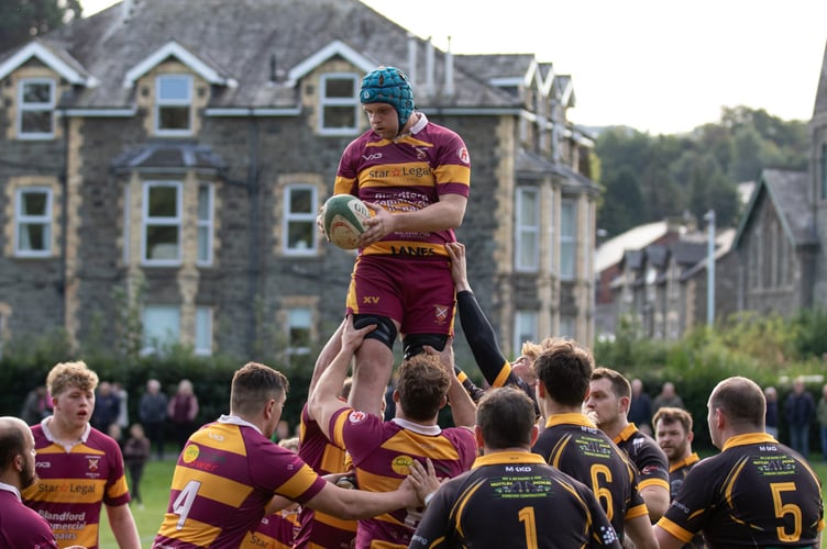 An Aber player defies gravity to claim the ball