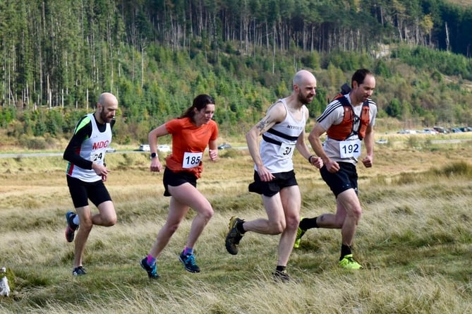 Runners take on the climb to the top of Fan Fawr