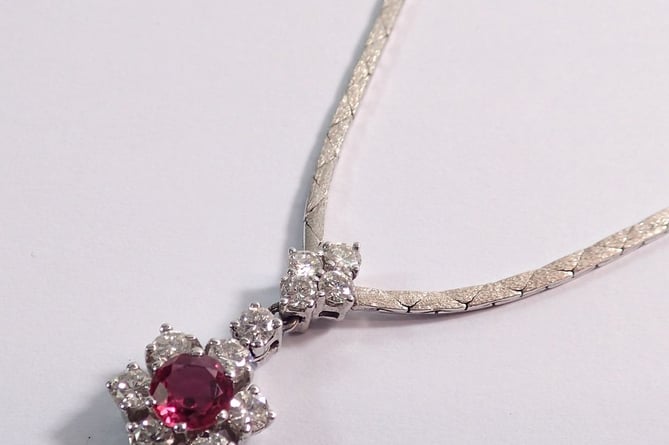 A ruby and diamond pendant