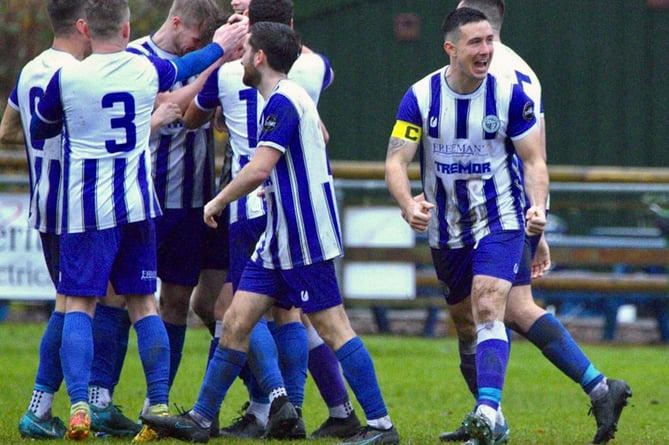 Blues players celebrate a goal against the Bluebirds