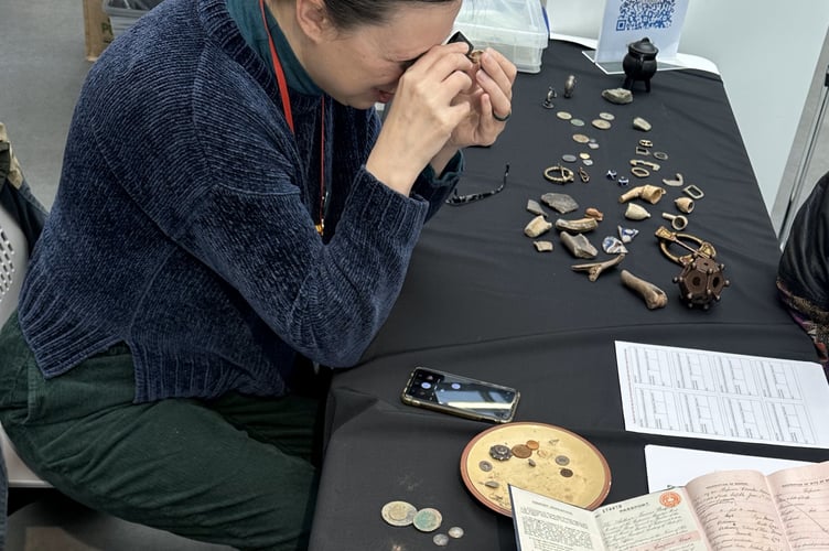 Nicola Kelly from Amgueddfa Cymru – National Museum Wales, examining finds brought in on the day.

