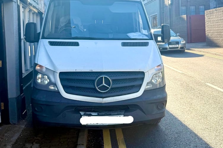 The driver of this illegally parked van received a traffic notice